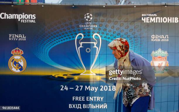 An old woman walks past the site of the 2018 UEFA Champions League Final fan zone in central in Kiev, Ukraine, 23 May, 2018. Kiev is preparing for...