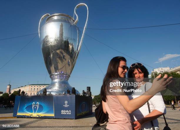 Women take a selfie in front of a giant replica of the UEFA Champions League trophy in centr of Kiev, Ukraine, 23 May, 2018.Kiev is preparing for the...