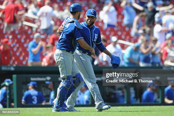 Kelvin Herrera and Drew Butera of the Kansas City Royals celebrate after defeating the the St. Louis Cardinals 5-2 at Busch Stadium on May 23, 2018...