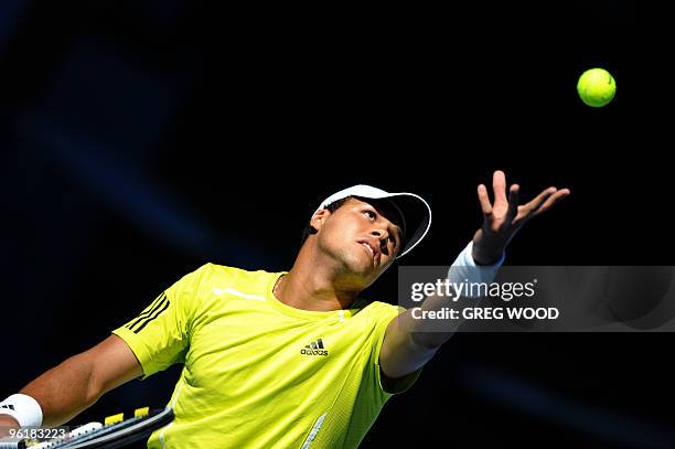 French tennis player Jo-Wilfried Tsonga serves during his fourth round men's singles match against Spanish opponent Nicolas Almagro at the Australian...