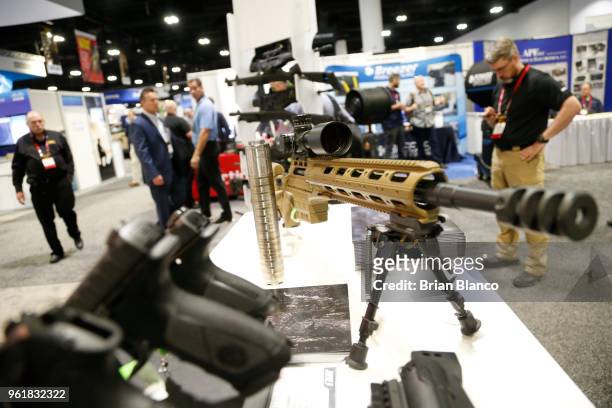 Attendees inspect the latest military technology and gear, including this Sako TRG M10 rifle, during the Special Operations Forces Industry...