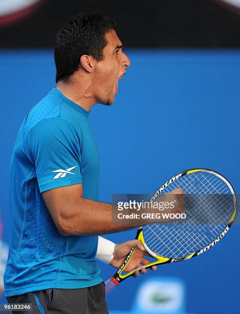 Spanish tennis player Nicolas Almagro shouts as he celebrates winning a point during his fourth round mens singles match against French opponent...