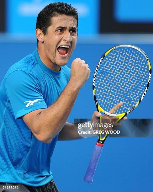 Spanish tennis player Nicolas Almagro shouts as he celebrates winning a point during his fourth round mens singles match against French opponent...