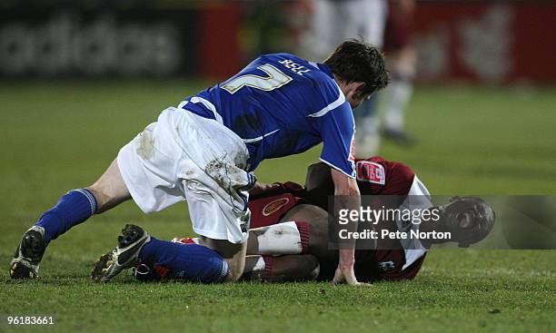 Abdul Osman of Northampton Town grimaces in agony after a clash with Lee Bell of Macclesfield Town during the Coca Cola League Two Match between...