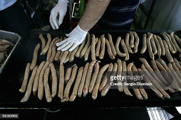 Chef prepares sausages for the Backyard BBQ sizzle as Australia celebrates Australia Day at Hyde Park on January 26, 2010 in Sydney, Australia....