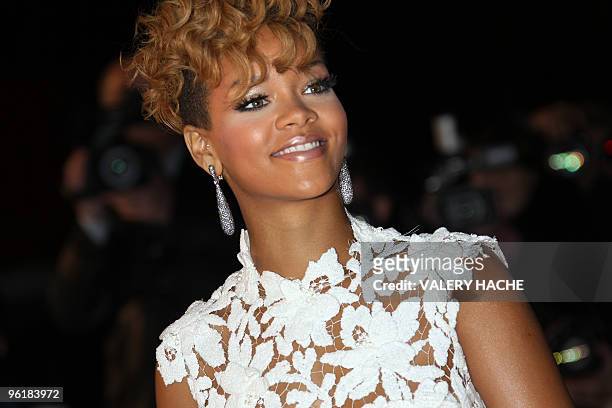 Singer Rihanna, of Barbados, poses upon her arrival at the Palais des Festivals in Cannes, southern France, on January 23 to attend French radio...