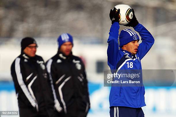 Rafinha is seen infront of head coach Felix Magath and assistant coach Bernd Hollerbach during a Schalke 04 training session on January 26, 2010 in...