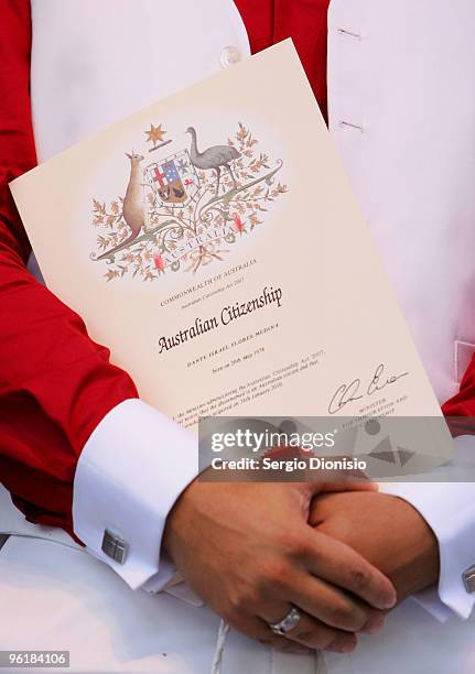 Certificate of Australian Citizenship is held by Dante Irael Flores Medina after receiving his Australian Citizenship as part of the Australia Day...