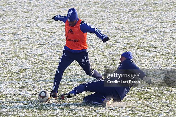 Jefferson Farfan is challenged by goalkeeper Mathias Schober during a Schalke 04 training session on January 26, 2010 in Gelsenkirchen, Germany.