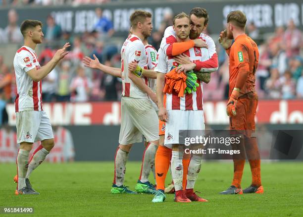 Goalkeeper Thomas Kessler of Koeln hugs Marcel Risse of Koeln after the Bundesliga match between 1. FC Koeln and FC Schalke 04 at RheinEnergieStadion...