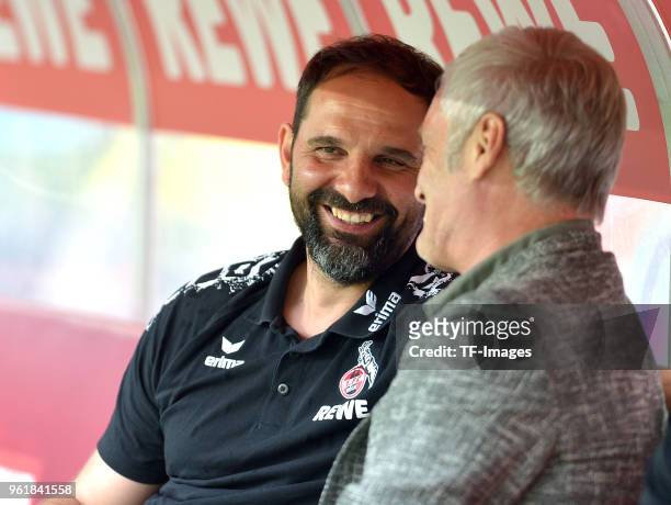 Head coach Stefan Ruthenbeck of Koeln and Armin Veh of Koeln laugh prior to the Bundesliga match between 1. FC Koeln and FC Schalke 04 at...