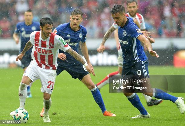 Leonardo Bittencourtof Koeln, Leon Goretzka of Schalke and Franco Di Santo of Schalke battle for the ball during the Bundesliga match between 1. FC...