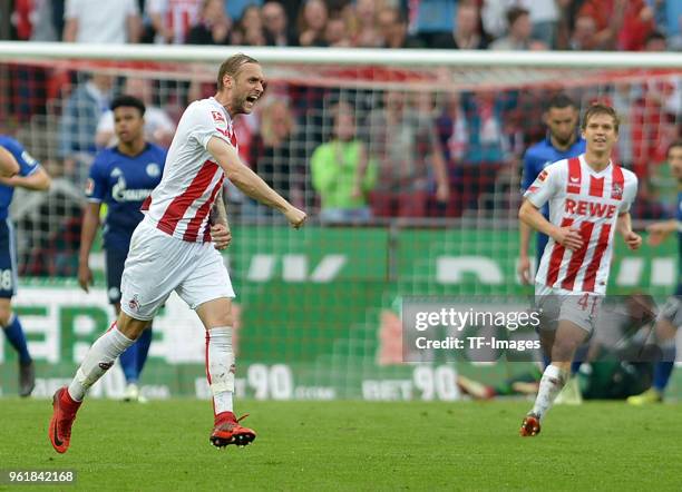 Marcel Risse of Koeln celebrates after scoring his team`s second goal during the Bundesliga match between 1. FC Koeln and FC Schalke 04 at...