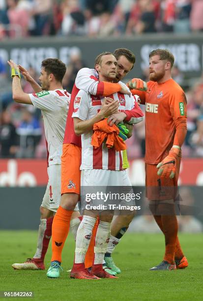 Goalkeeper Thomas Kessler of Koeln comforts Marcel Risse of Koeln after the Bundesliga match between 1. FC Koeln and FC Schalke 04 at...