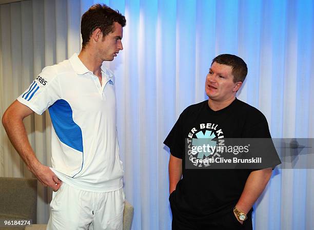 Andy Murray of Great Britain chats with boxer Ricky Hatton after Murrary's quarterfinal match win against Rafael Nadal of Spain during day nine of...