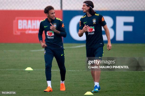 Brazil's players Neymar and Filipe Luis attend a training session of the national football team ahead of FIFA's 2018 World Cup, at Granja Comary...
