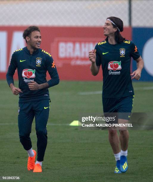 Brazil's players Neymar and Filipe Luis attend a training session of the national football team ahead of FIFA's 2018 World Cup, at Granja Comary...