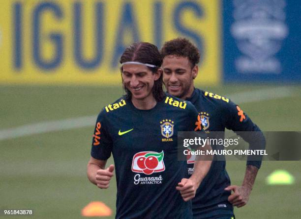 Brazil's players Neymar and Filipe Luis attend a training session of the national football team ahead of FIFA's 2018 World Cup, at Granja Comary...