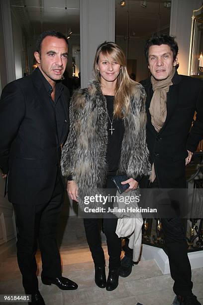 Nikos Aliagas, Sarah Lavoine and Marc Lavoine attend the Balmain flagship launch on January 25, 2010 in Paris, France.