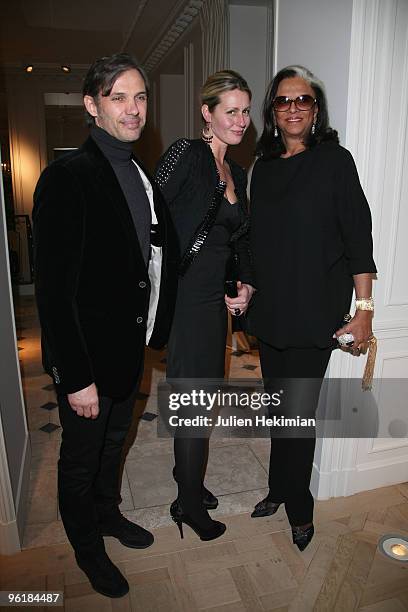Paul Belmondo, his wife Luana and Betty Lagardere attend the Balmain flagship launch on January 25, 2010 in Paris, France.