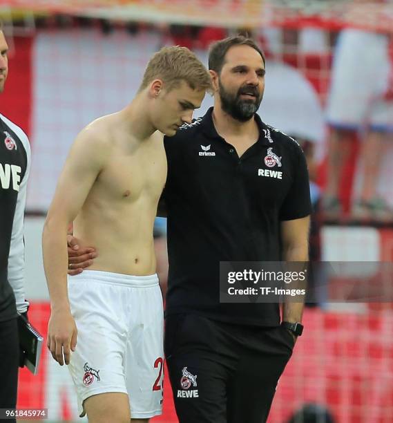 Tim Handwerker of Koeln and Head coach Stefan Ruthenbeck of Koeln look dejected during the Bundesliga match between 1. FC Koeln and FC Schalke 04 at...