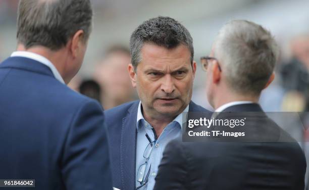 Clemens Toennies of Schalke speaks with Christian Heidel of Schalke and Alexander Wehrle of Koeln prior to the Bundesliga match between 1. FC Koeln...