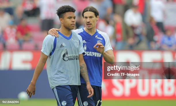 Weston James Earl McKennie of Schalke speaks with Benjamin Stambouli of Schalke during the Bundesliga match between 1. FC Koeln and FC Schalke 04 at...