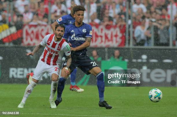 Leonardo Bittencourt of Koeln and Thilo Kehrer of Schalke controls the ball during the Bundesliga match between 1. FC Koeln and FC Schalke 04 at...