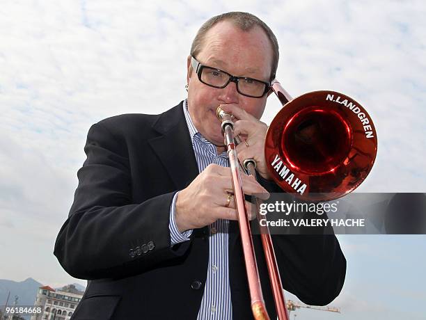 Swedish trombonist Nils Ladgren poses during a photocall on January 26, 2010 in Cannes, southeastern France, as part of the music world's largest...