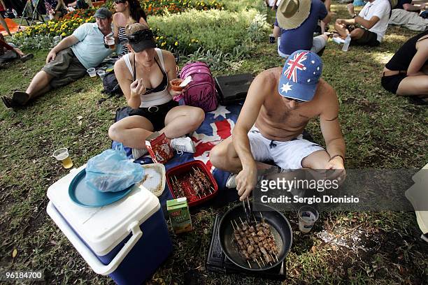 Greg Brown and his partner Shavorne Leek cook a Backyard BBQ as Australia celebrates Australia Day at Hyde Park on January 26, 2010 in Sydney,...