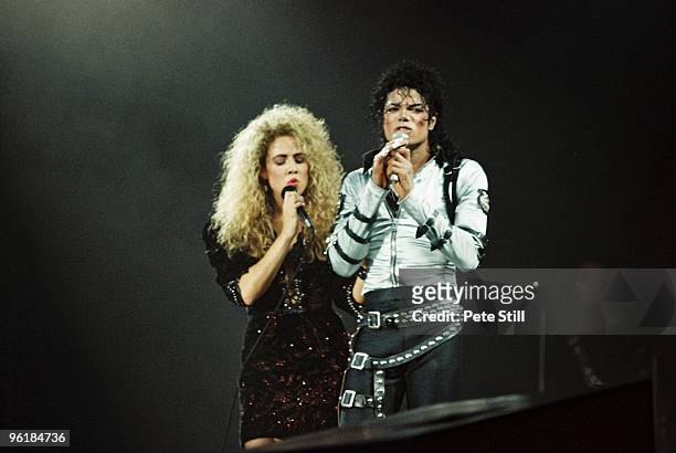 Sheryl Crow joins Michael Jackson to perform on stage on his BAD tour at Wembley Stadium on 23rd July 1988 in London, United Kingdom.