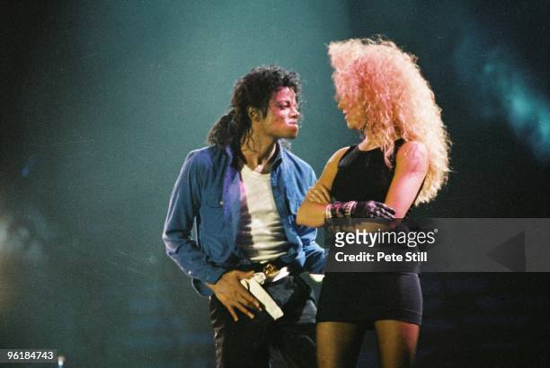 Sheryl Crow joins Michael Jackson to perform on stage on his BAD tour at Wembley Stadium on 23rd July 1988 in London, United Kingdom.