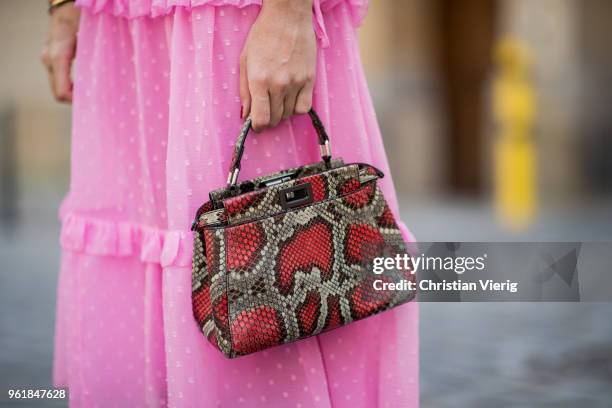 Sonia Lyson wearing pink ruffled dress Topshop, Gucci knee socks, pink Manolo Blahnik shoes, Fendi bag, Zara sunglasses on May 23, 2018 in Berlin,...