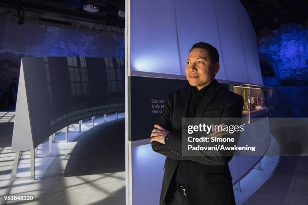 Curator Edson Cabalfin poses at the Philippine Pavilion in the Arsenale during the press preview of the 16th International Architecture Biennale on...