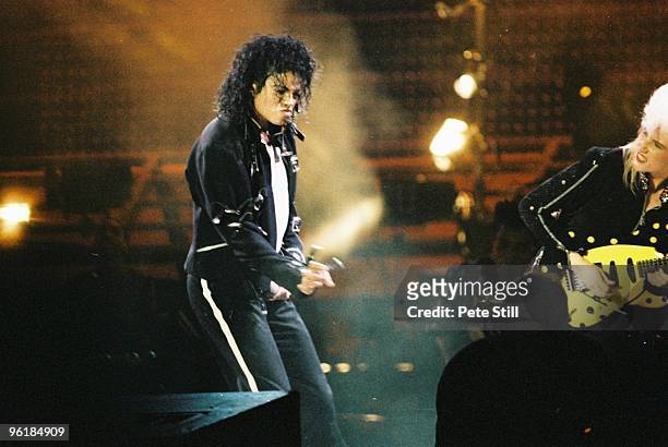 Michael Jackson and Jennifer Batten perform on stage on his BAD tour at Wembley Stadium on 23rd July 1988 in London, United Kingdom.