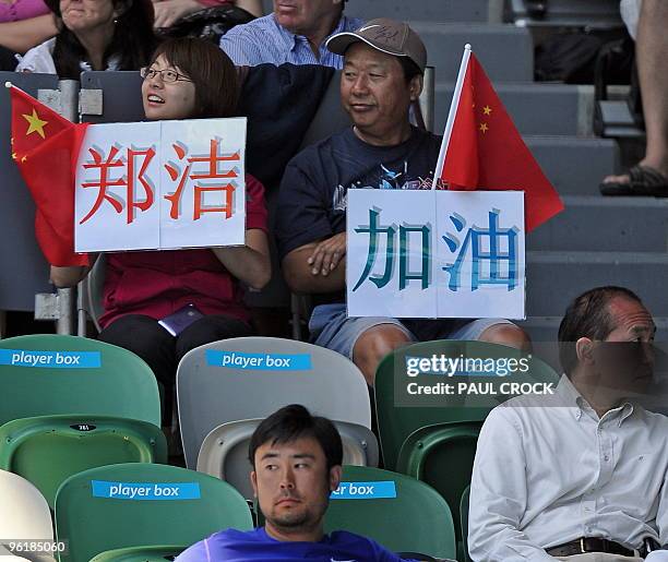 Members of Chinese tennis player Zheng Jie's family sit in the player's box watching Zheng play against Maria Kirilenko of Russia in their women's...