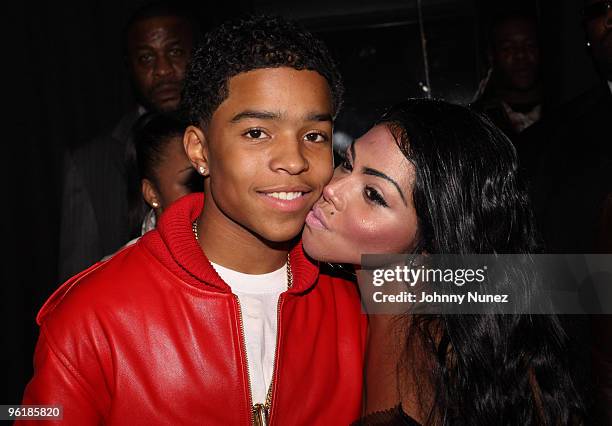 Justin Dior Combs and Lil' Kim attend Justin Dior Comb's 16th birthday party at M2 Ultra Lounge on January 23, 2010 in New York City.