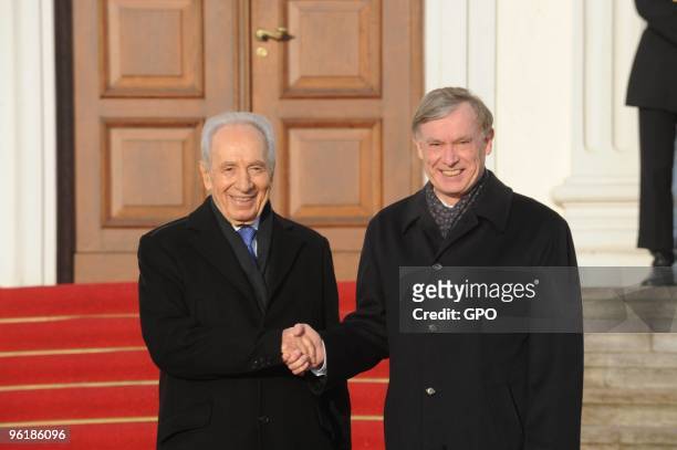 In this handout image supplied by the Israeli Government Press Office , German President Horst Koehler welcomes Israeli President Shimon Peres at the...