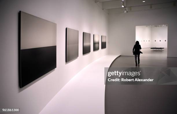 Museum visitor walks through a room featuring photographs by Hiroshi Sugimoto at the Hirshhorn Museum and Sculpture Garden on the National Mall in...