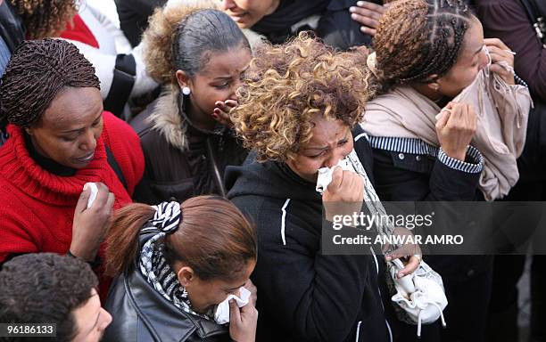 Ethiopian women mourn the death of relatives in a plane crash outside the mortuary of a hospital in Beirut on January 26, 2010. Rescuers combed the...