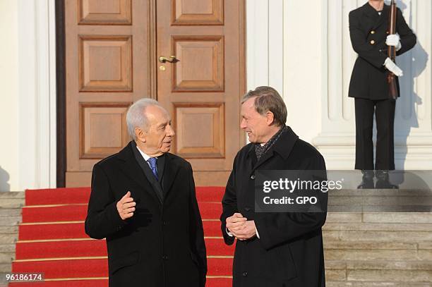 In this handout image supplied by the Israeli Government Press Office , German President Horst Koehler welcomes Israeli President Shimon Peres at the...