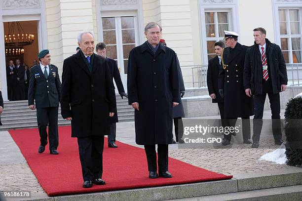 In this handout image supplied by the Israeli Government Press Office , German President Horst Koehler welcomes Israeli President Shimon Peres at the...