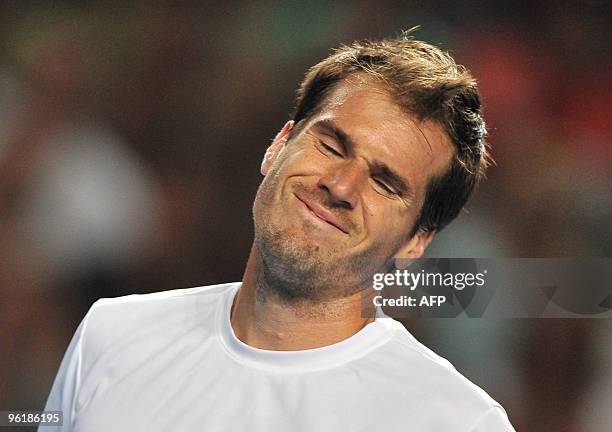 German tennis player Tommy Haas gestures during his third round men's singles match against French opponent Jo Wilfried Tsonga at the Australian Open...