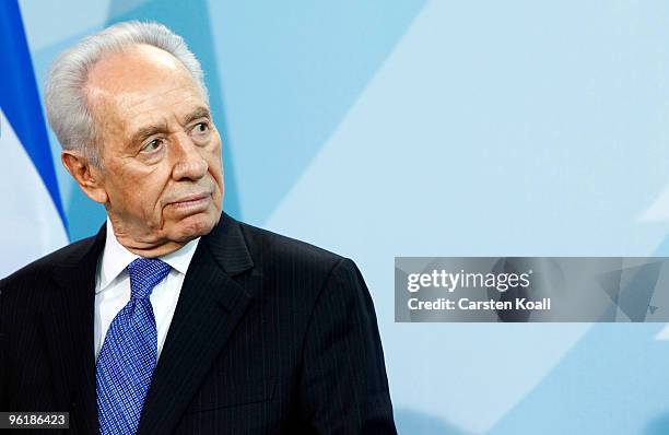 Israeli President Shimon Peres attends a press conference with German Chancellor Angela Merkel at the Chancellery on January 26, 2010 in Berlin,...