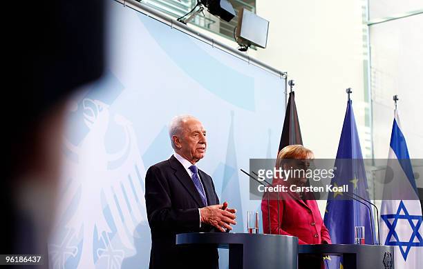 Israeli President Shimon Peres attends a press conference with German Chancellor Angela Merkel at the Chancellery on January 26, 2010 in Berlin,...