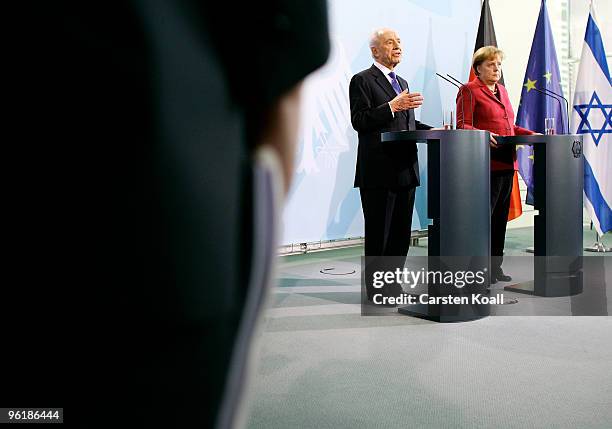 Israeli President Shimon Peres attends a press conference with German Chancellor Angela Merkel at the Chancellery on January 26, 2010 in Berlin,...