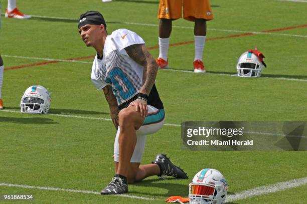 Miami Dolphins wide receiver Kenny Stills stretches during the Miami Dolphins Organized Team Activities at the Baptist Health Training Facility at...