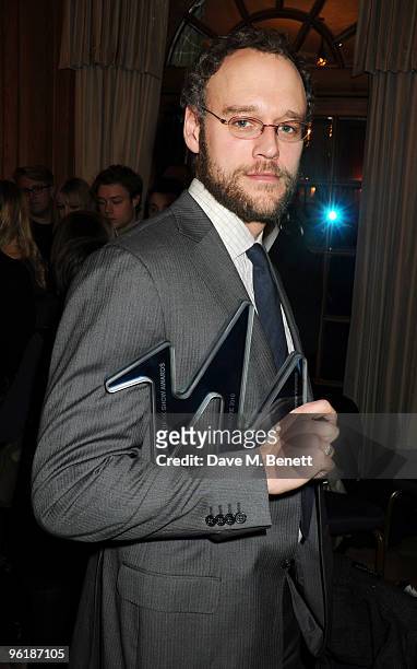 Elliot Cowan pose with his Best Theatre Award for A Streetcar Named Desire at the South Bank Show Awards, at The Dorchester on January 26, 2010 in...