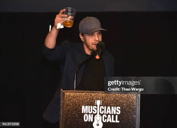 Recording artist Gavin DeGraw speaks onstage as Musicians On Call hosts A Night To Celebrate the Healing Power of Music at Madison Square Garden on...