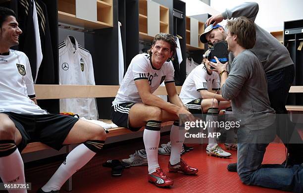 Picture released on January 26, 2010 shows players of the German national football team Mario Gomez during a shooting for an advertising spot for...